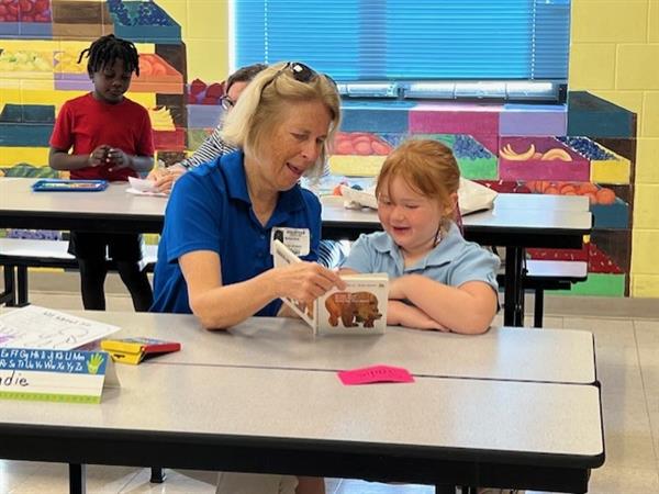 student with a reader